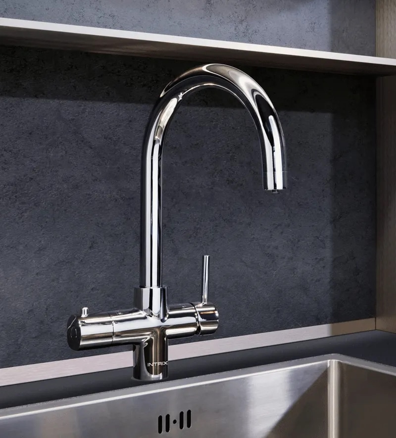 A stainless steel kitchen sink with a 4-in-1 Intrix One Tap faucet.